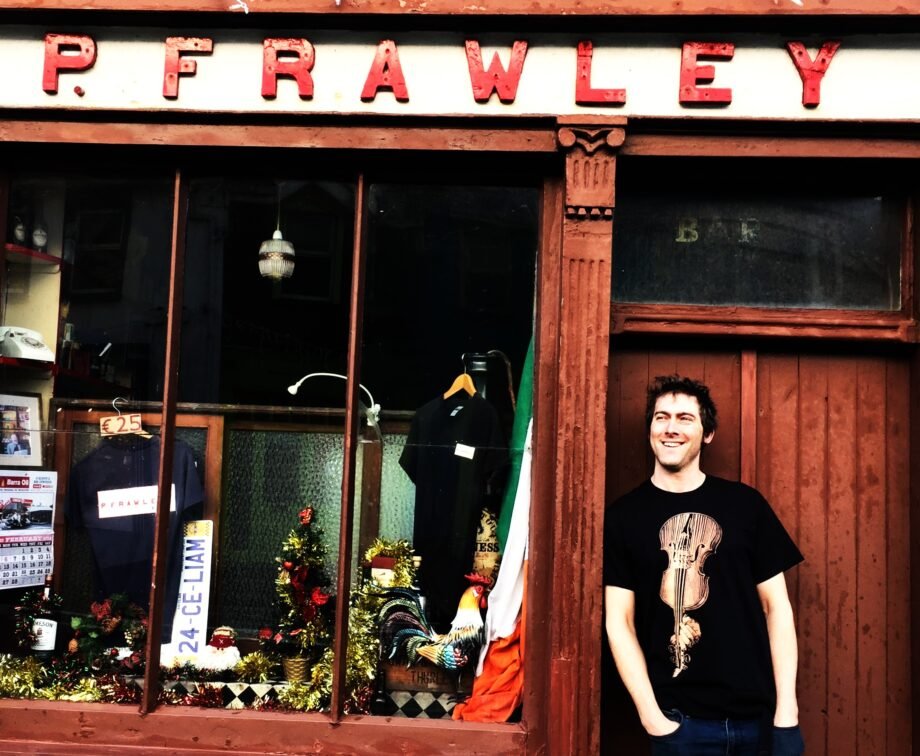 One of Clare's finest fiddlers Neil Fitzgibbon outside Frawleys pub, Lahinch
